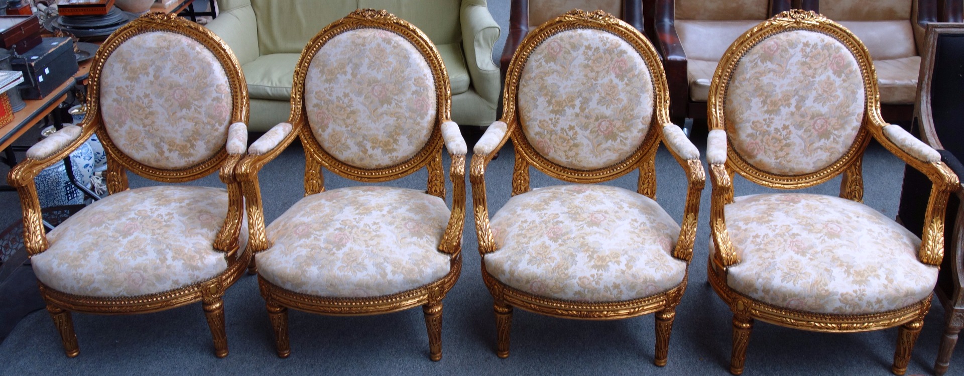 Appraisal: A set of four Louis XVI style gilt framed fauteuils