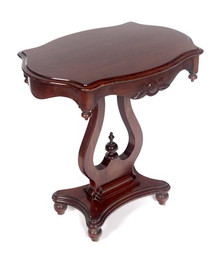 Appraisal: A Victorian mahogany side table the moulded serpentine top over