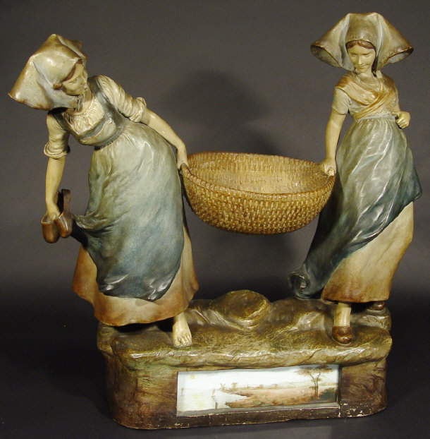 Appraisal: Large Art Nouveau pottery figure group of two young girls