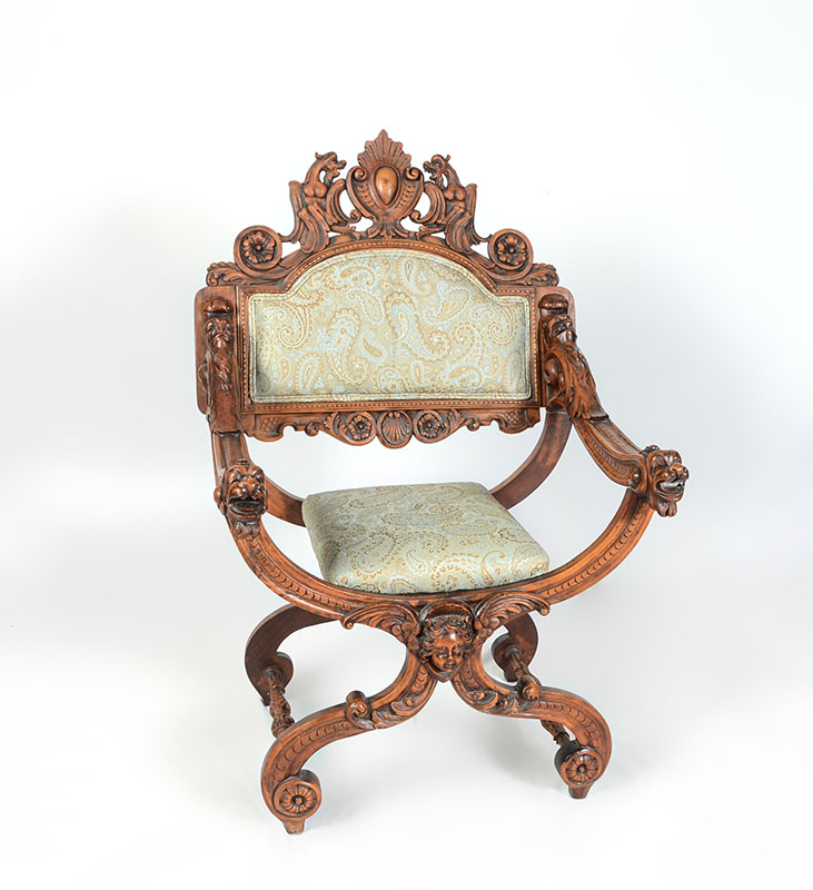 Appraisal: CARVED RENAISSANCE REVIVAL SAVONAROLA CHAIR Profusely carved in the Italian