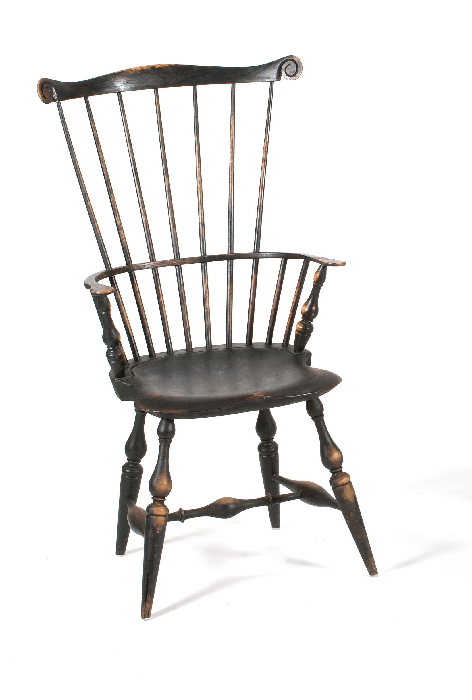 Appraisal: TH CENTURY COMB-BACK WINDSOR ARMCHAIR under black paint WCW carved