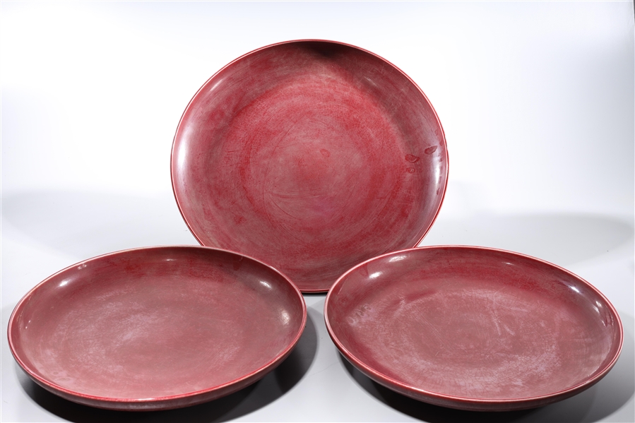 Appraisal: Group of three Chinese oxblood porcelain chargers D largest approx