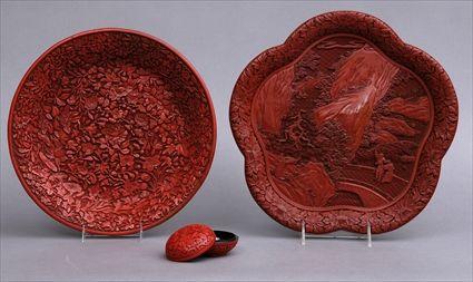 Appraisal: TWO CHINESE CINNABAR LACQUER TRAYS The one pentagonal relief-carved with