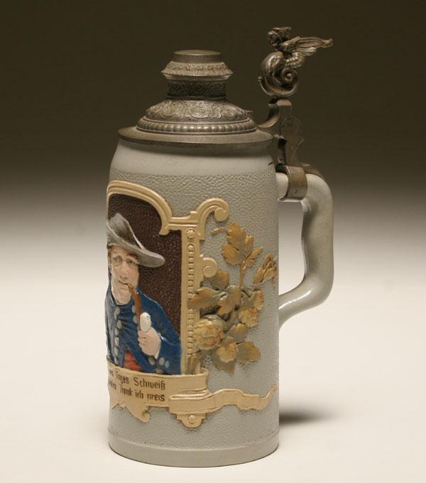 Appraisal: German beer stein Mettlach pottery with embossed pipe smoking man