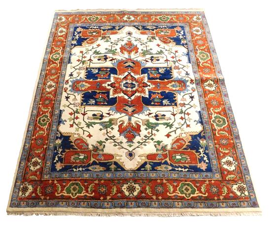 Appraisal: RUG Serapi carpet marine blue ground pumpkin colored medallions and