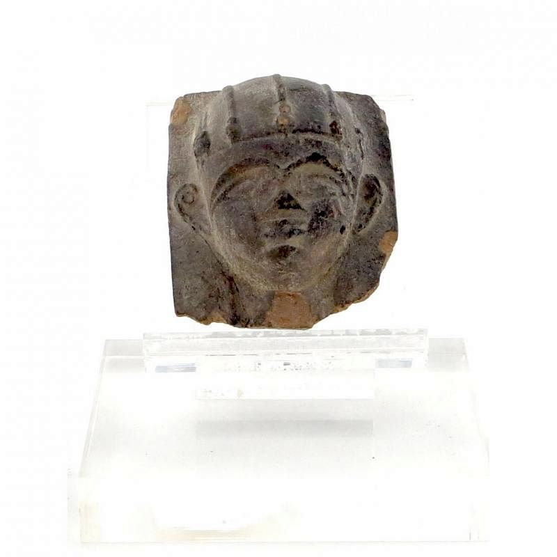 Appraisal: Egyptian Style Sandstone Relief Carved Face mounted on Lucite Condition