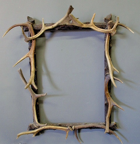 Appraisal: Black Forest carved picture frame late th c with stag