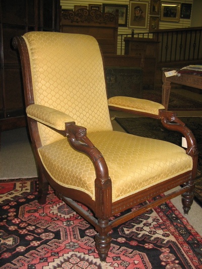 Appraisal: VICTORIAN ARMCHAIR American c having an Eastlake style carved walnut