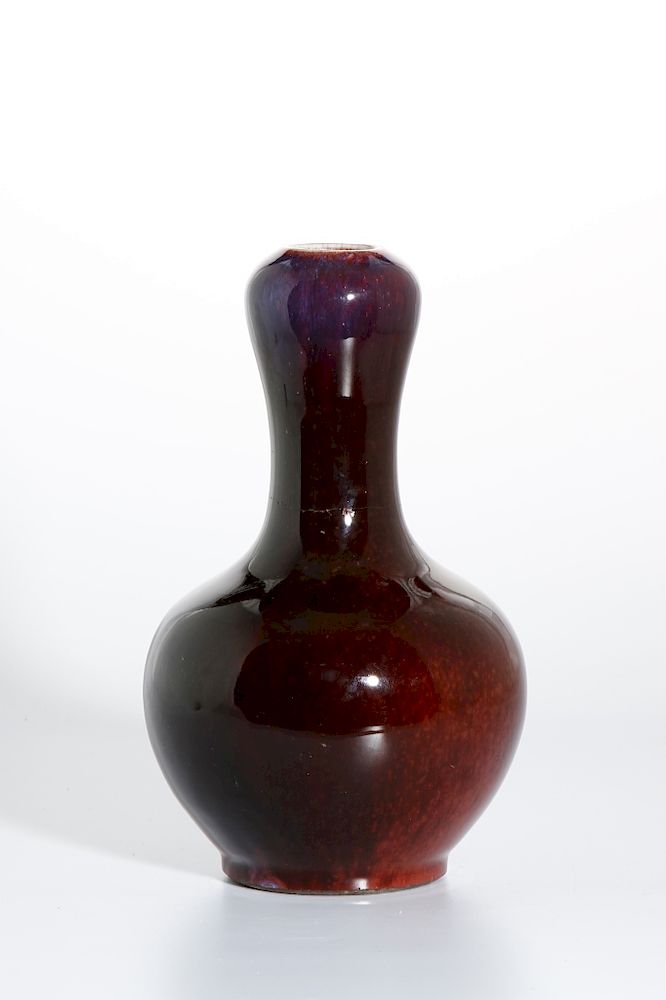 Appraisal: Chinese Flambe-Glazed Garlic-Mouth Bottle Vase Cast with a globular body