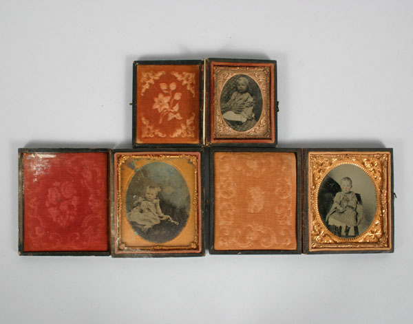 Appraisal: Tintypes of three young children one being held by large