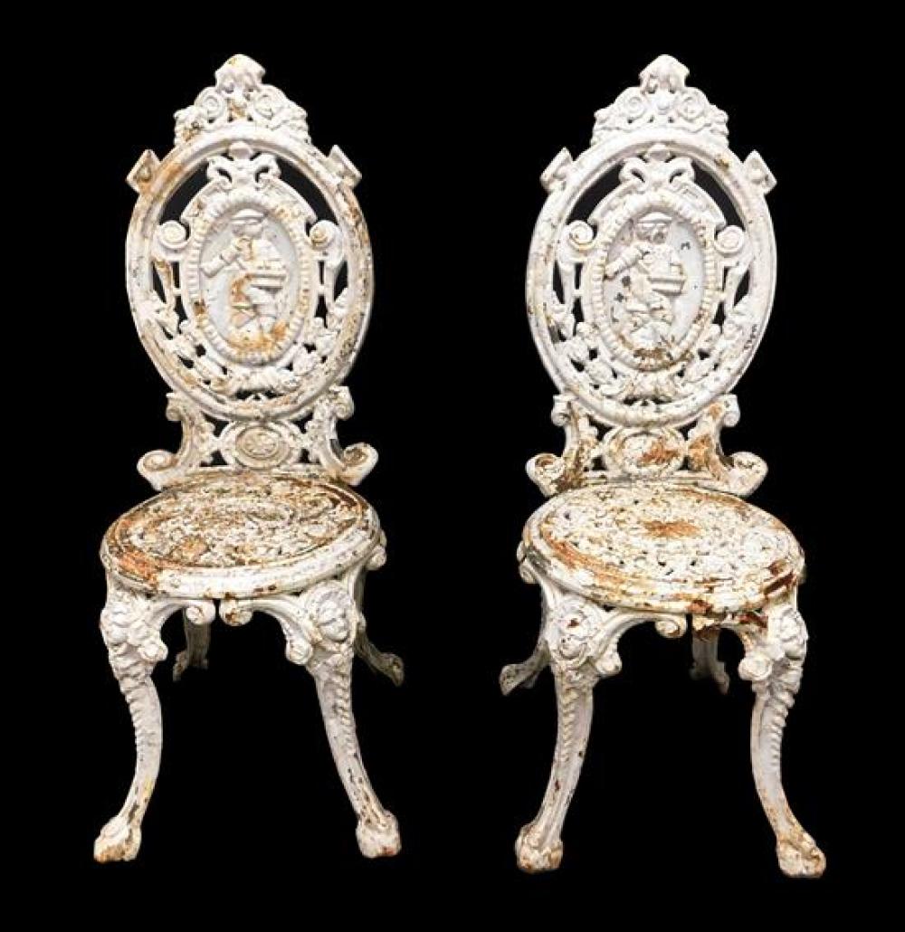 Appraisal: GARDEN Pair of cast iron medallion back side chairs English