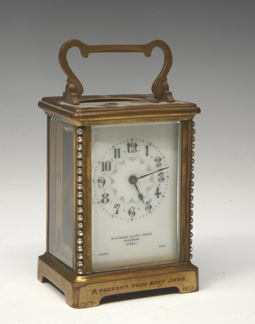 Appraisal: A FRENCH CARRIAGE CLOCK with brass case inset paste white