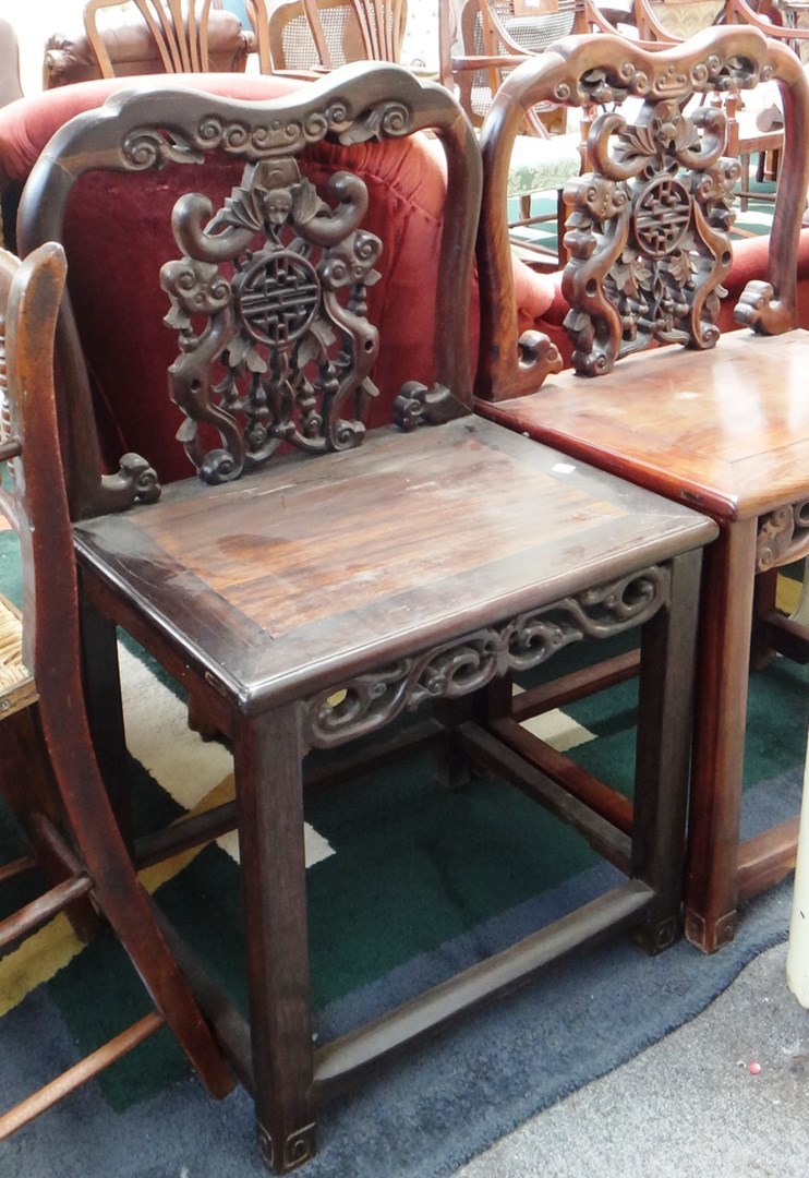 Appraisal: A pair of early th century Chinese hongmu side chairs