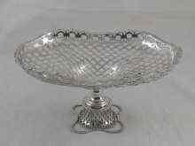 Appraisal: A silver footed cake stand the bowl and foot pierced