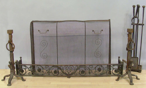 Appraisal: Wrought iron fireplace set early th c andirons - h