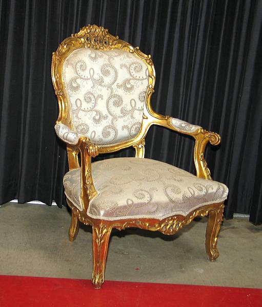 Appraisal: A pair of Louis XV style giltwood fauteuils modern height