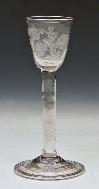 Appraisal: A SINGLE WINE GLASS th Century with etched flower sprays