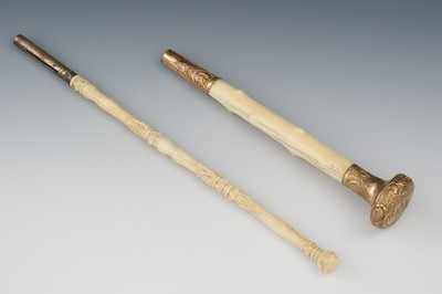 Appraisal: Two Carved Parasol Handles ca th Century An ivory handle