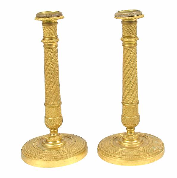 Appraisal: A pair of Empire style gilt bronze candlesticks height in