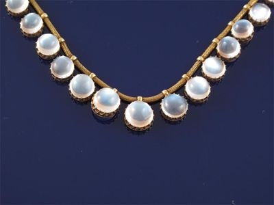 Appraisal: A graduated cabochon moonstone fringe necklace Gold coronet mounts suspend