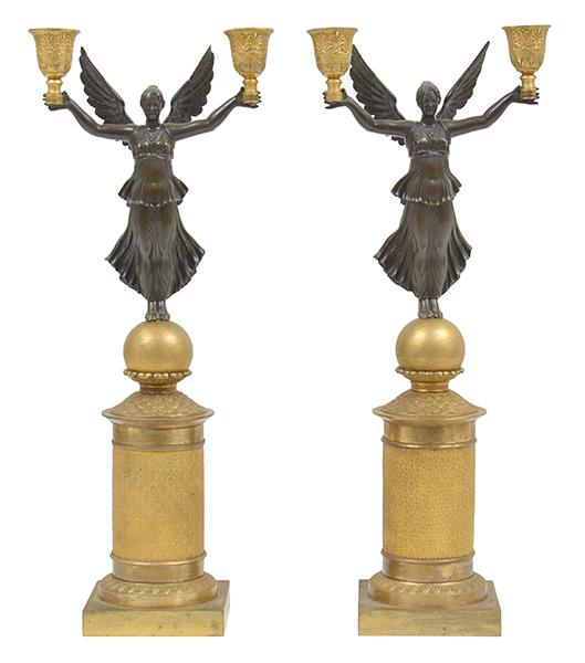 Appraisal: A PAIR OF BRONZE AND GILT BRONZE WINGED VICTORY CANDELABRA