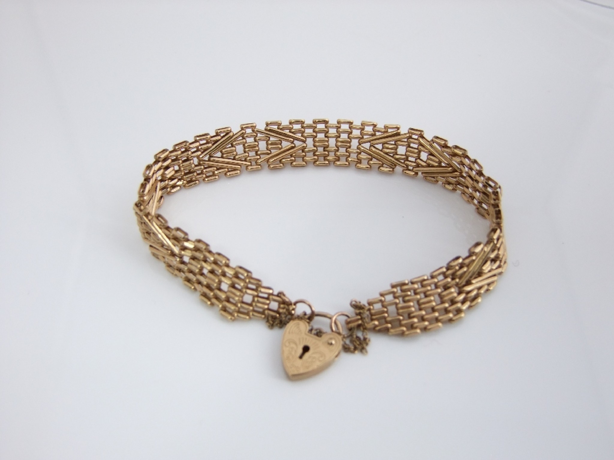 Appraisal: A ct gold link bracelet with padlock clasp gms