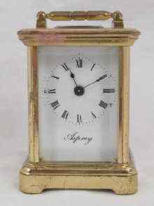 Appraisal: A miniature carriage clock retailed by Asprey Approx cm high