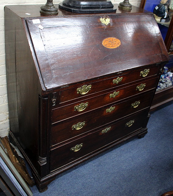 Appraisal: A LATE TH CENTURY OAK BUREAU the fall front with