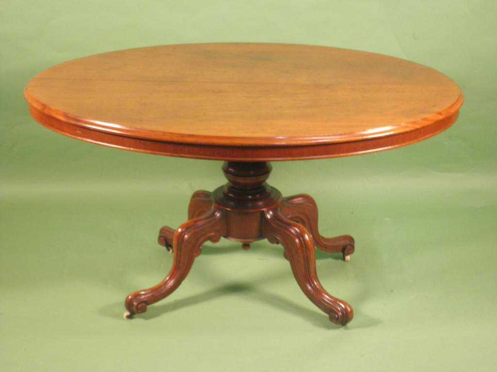 Appraisal: A Victorian mahogany oval breakfast table on a turned column