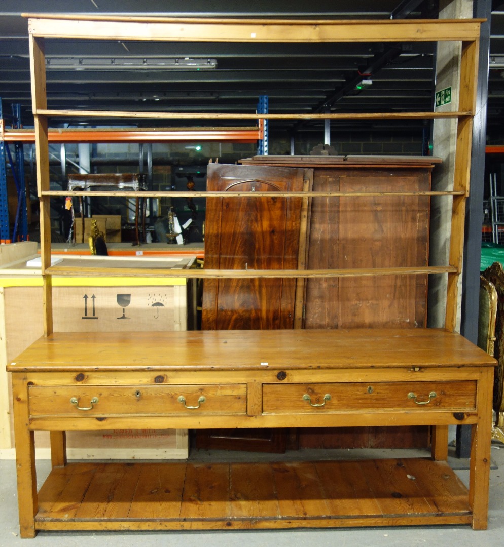 Appraisal: A large pine dresser with three tier open plate rack