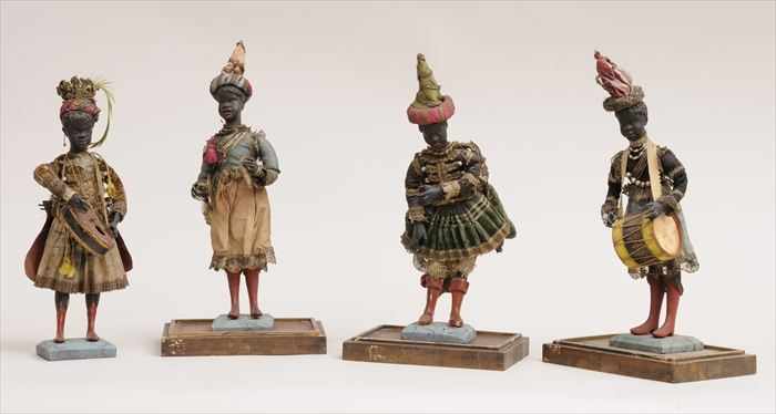 Appraisal: SET OF FOUR NEAPOLITAN WOOD AND CLOTH FIGURES OF BLACKAMOOR