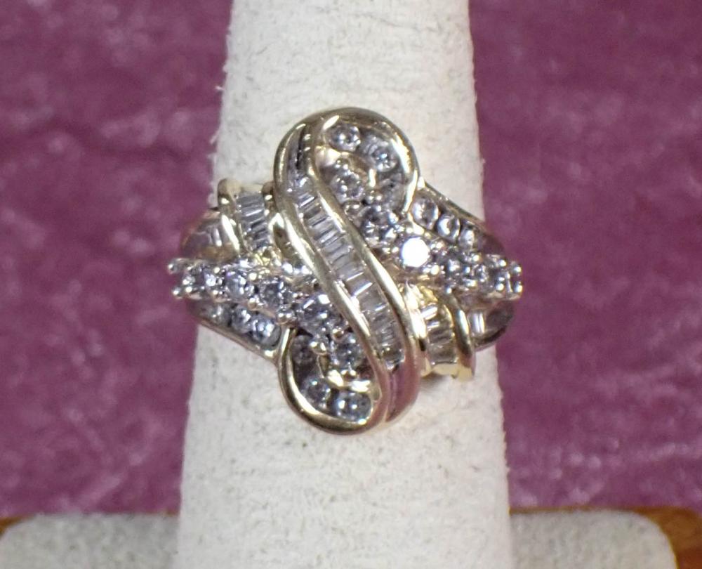 Appraisal: DIAMOND AND FOURTEEN KARAT GOLD CLUSTER RING The yellow gold