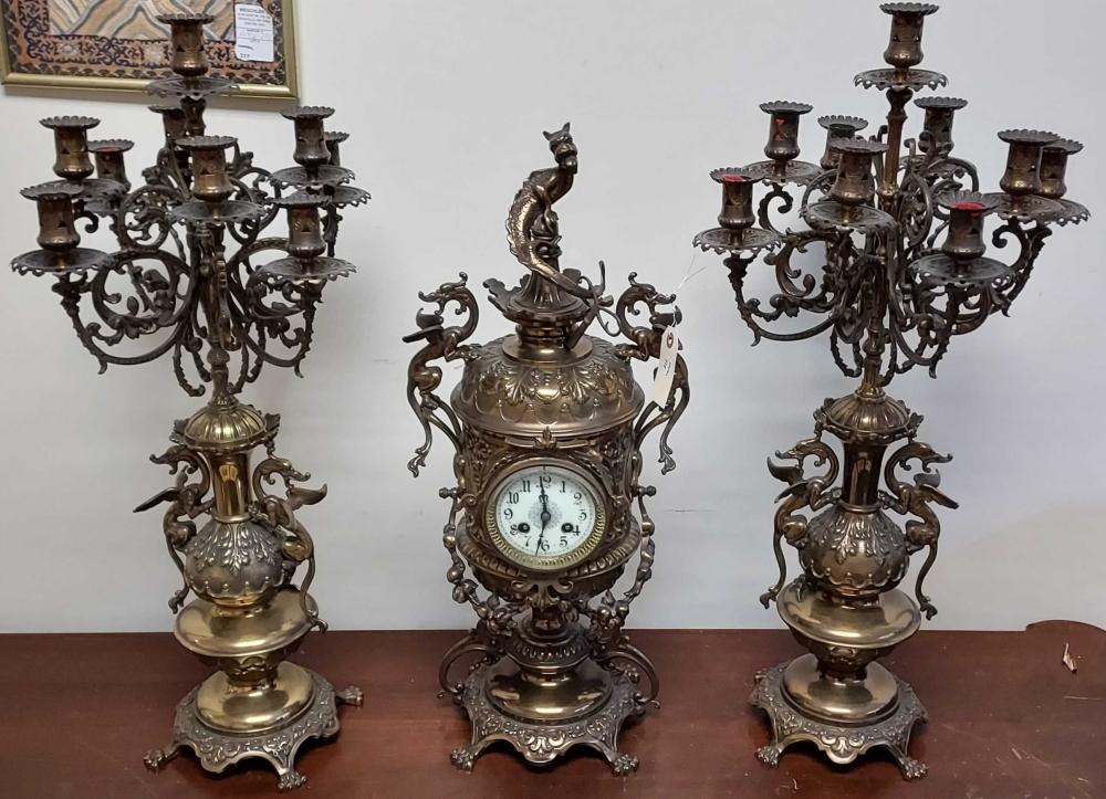 Appraisal: BELGIAN EMPIRE STYLE GILT METAL THREE-PIECE CLOCK GARNITURE H IN