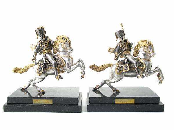 Appraisal: A pair of Italian gilt heightened silvered bronze figures of