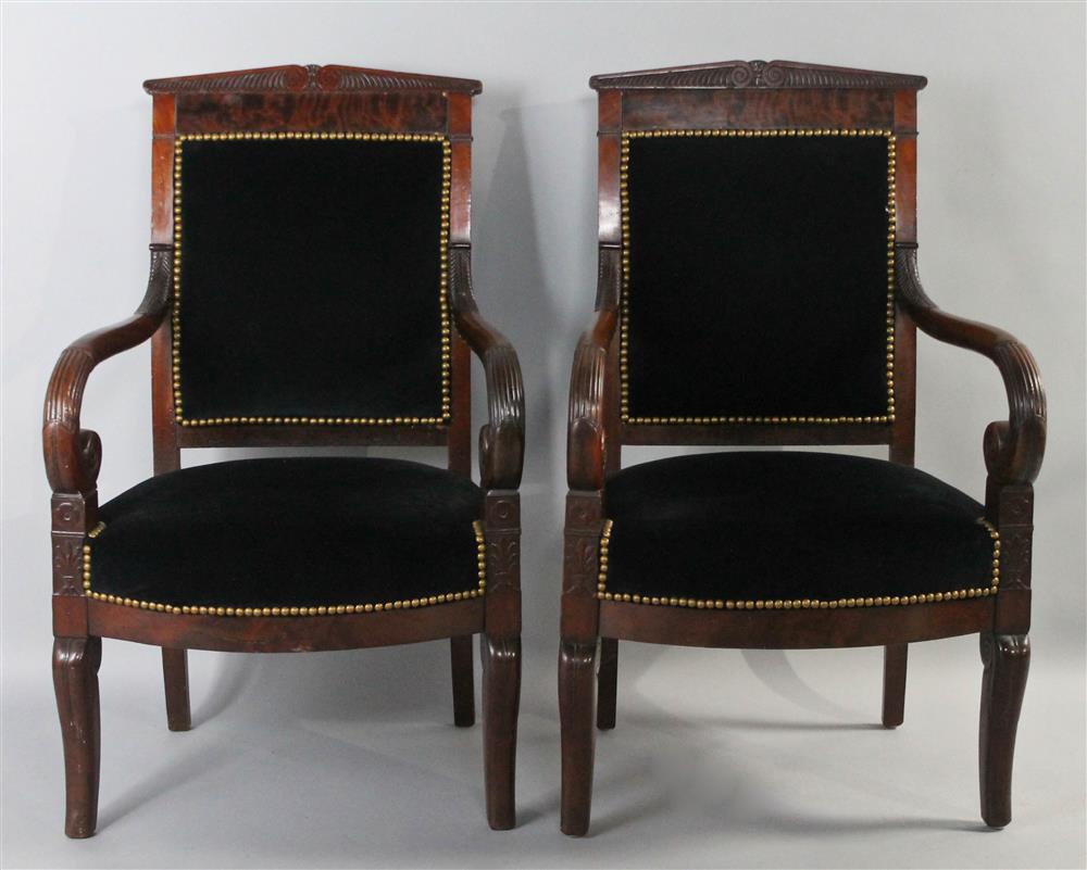 Appraisal: PAIR OF AMERICAN CLASSICAL CARVED MAHOGANY LIBRARY ARMCHAIRS each having