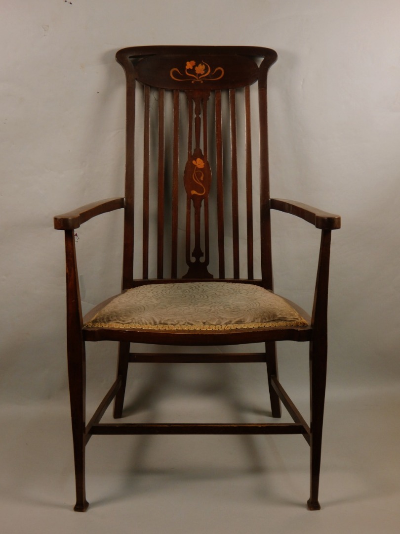 Appraisal: An Edwardian mahogany and marquetry open armchair with a slatted