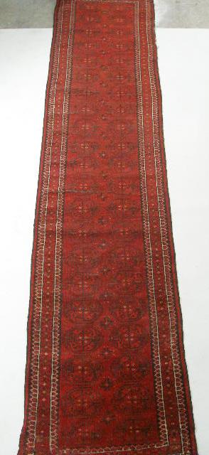 Appraisal: Tekke Runner Early th c hand-tied on wool base predominately