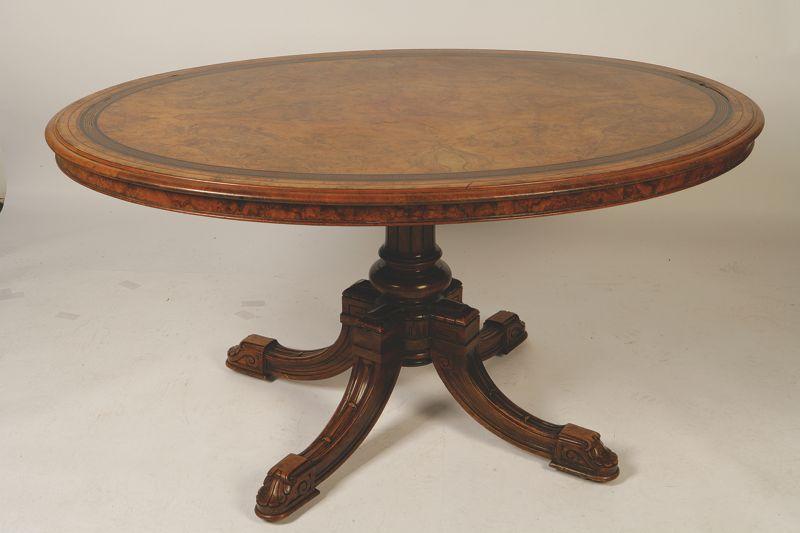 Appraisal: A VICTORIAN GRECIAN REVIVAL WALNUT VENEERED TIP-TOP CENTRE TABLE the