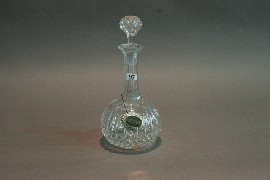 Appraisal: A cut crystal decanter and stopper with EP shery label