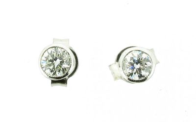 Appraisal: A pair of diamond stud earrings The circular cut diamonds