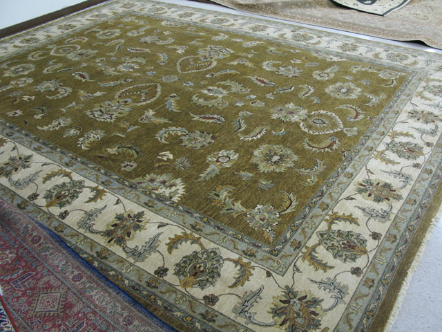 Appraisal: ORIENTAL INDO-PERSIAN GRAND ROOM CARPET featuring a foliate decorated moss