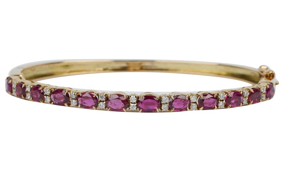 Appraisal: KARAT YELLOW GOLD DIAMOND RUBY BANGLE BRACELETcontaining oval mixed cut