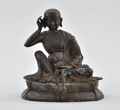 Appraisal: A Bronze Statue of Sitting Buddha Bronze patinated listening Buddha