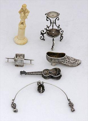 Appraisal: GROUP OF FIVE SILVER MINIATURE CABINET ARTICLES AND AN IVORY