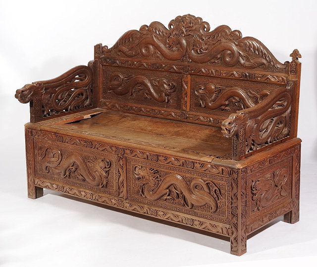 Appraisal: A CHINESE CARVED SETTLE the back with dragon designs with