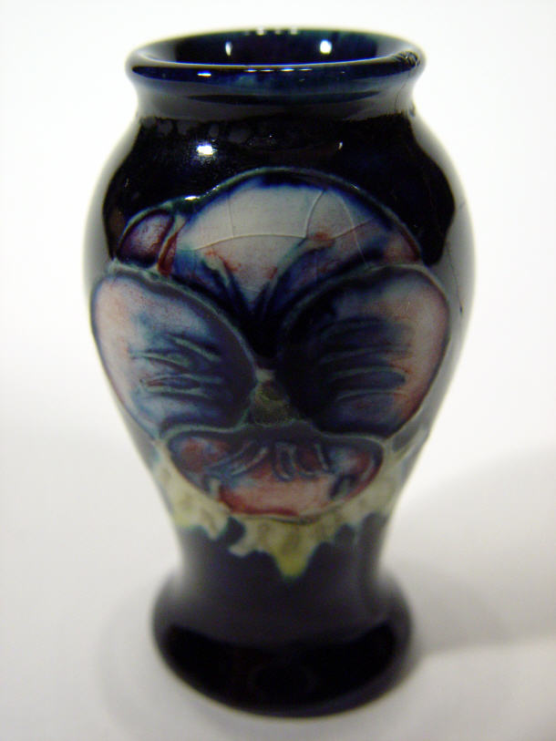 Appraisal: Miniature Moorcroft pottery vase hand painted and tubelined with pansy