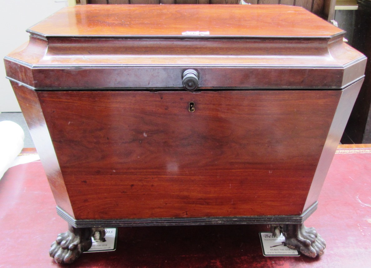 Appraisal: A George IV ebony strung sarcophagus mahogany cellarette on lions