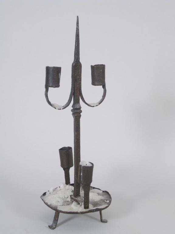 Appraisal: An iron four branch Candle Holder with central pricket on