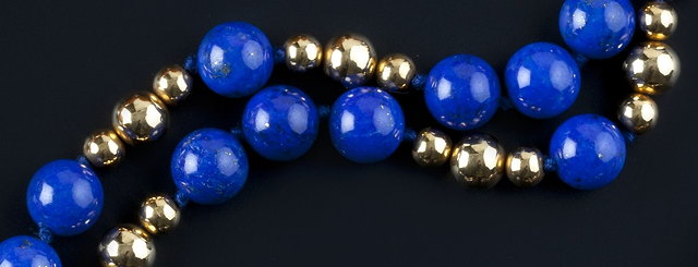 Appraisal: A lapis lazuli bead necklace comprising a single strand of