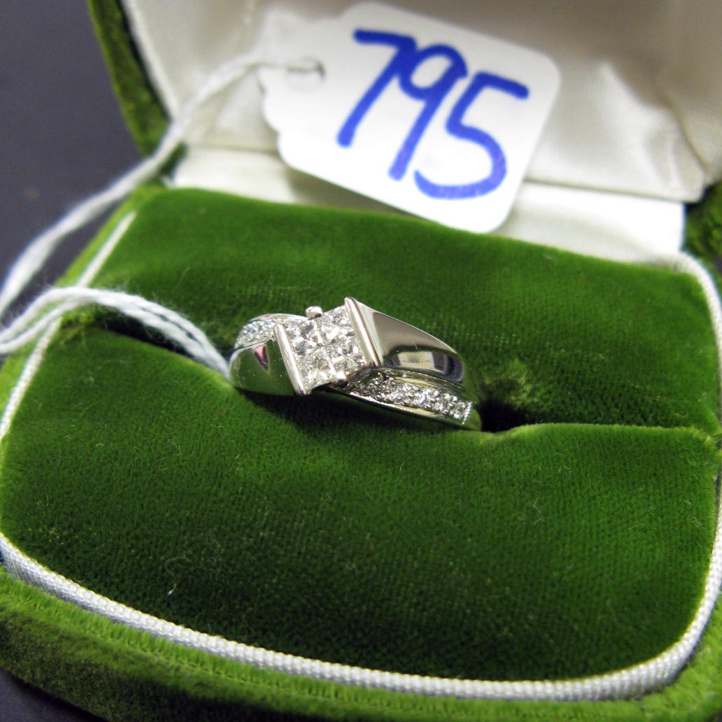 Appraisal: DIAMOND AND FOURTEEN KARAT WHITE GOLD RING centering four princess-cut